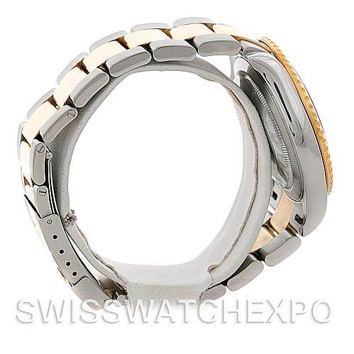 The image shows a side view of a Rolex Yacht-Master 16623 Men's Stainless Steel Blue Dial 16623 Men's Stainless Steel Blue Dial watch, highlighting its gold bezel and two-tone bracelet.