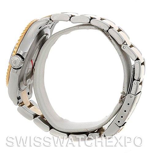 This side view of the Rolex Yacht-Master 16623 Men's Stainless Steel Blue Dial 16623 Men's Stainless Steel Blue Dial watch shows the profile of the case and bracelet, including the crown and the clasp.