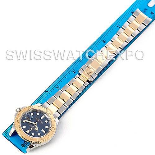 The image shows a top-down view of the entire Rolex Yacht-Master 16623 Men's Stainless Steel Blue Dial 16623 Men's Stainless Steel Blue Dial watch including its face, bracelet, and clasp next to a ruler for scale.