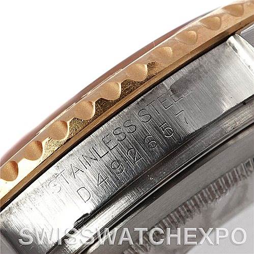 This close-up image shows the side engraving and part of the bezel of a Rolex Yacht-Master 16623 Men's Stainless Steel Blue Dial 16623 Men's Stainless Steel Blue Dial watch.