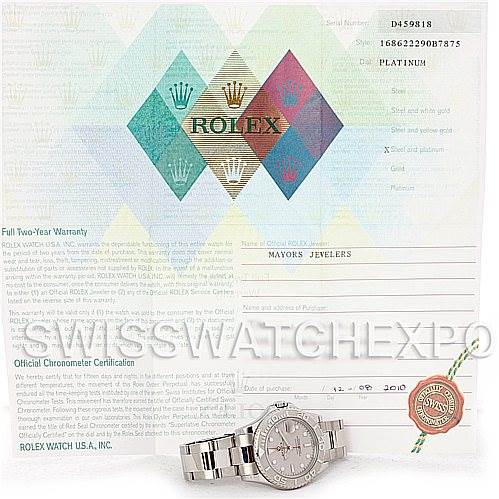 The image shows a Rolex Yacht-Master 168622 Stainless Steel Silver Dial 168622 Stainless Steel Silver Dial watch placed in front of its official chronometer certification document and warranty card.