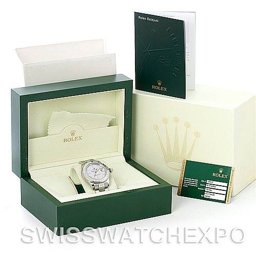 The Rolex Yacht-Master 16622 Men's Stainless Steel Silver Dial 16622 Men's Stainless Steel Silver Dial watch is displayed in its box, accompanied by a green booklet, warranty card, and outer packaging.