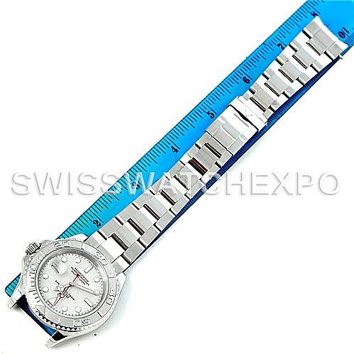 The image shows a top-down view of a Rolex Yacht-Master 16622 Men's Stainless Steel Silver Dial 16622 Men's Stainless Steel Silver Dial watch with a ruler measuring its band length.