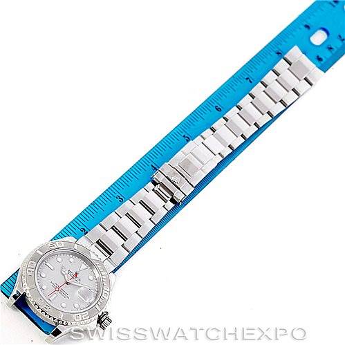 The image shows a top-down view of a Rolex Yacht-Master 16622 Men's Stainless Steel Silver Dial 16622 Men's Stainless Steel Silver Dial watch, displaying its full face, bezel, bracelet, and clasp next to a ruler.