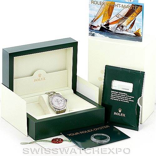 The Rolex Yacht-Master 16622 Men's Stainless Steel Silver Dial 16622 Men's Stainless Steel Silver Dial watch is shown from the front in an open box, along with its booklet, card, and tags.