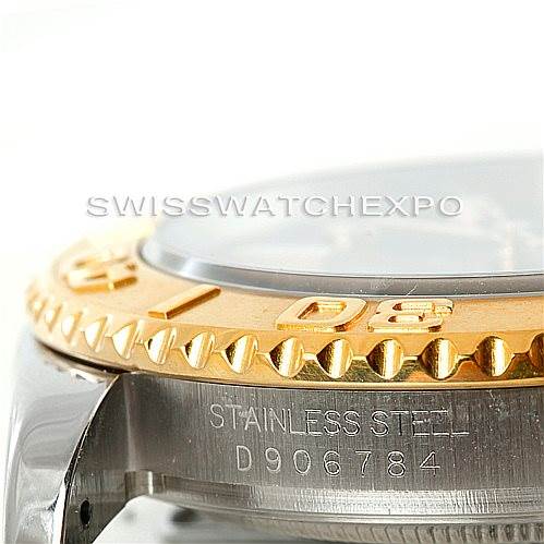 The image shows a close-up of the Yacht-Master model by Rolex, focusing on the stainless steel case and gold bezel.