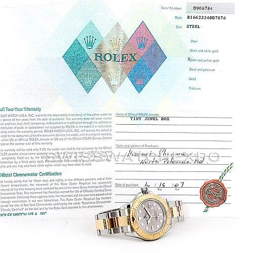 The image shows a Rolex Yacht-Master 16623 Men's Stainless Steel Grey Dial 16623 Men's Stainless Steel Grey Dial watch placed alongside its warranty and certification papers.