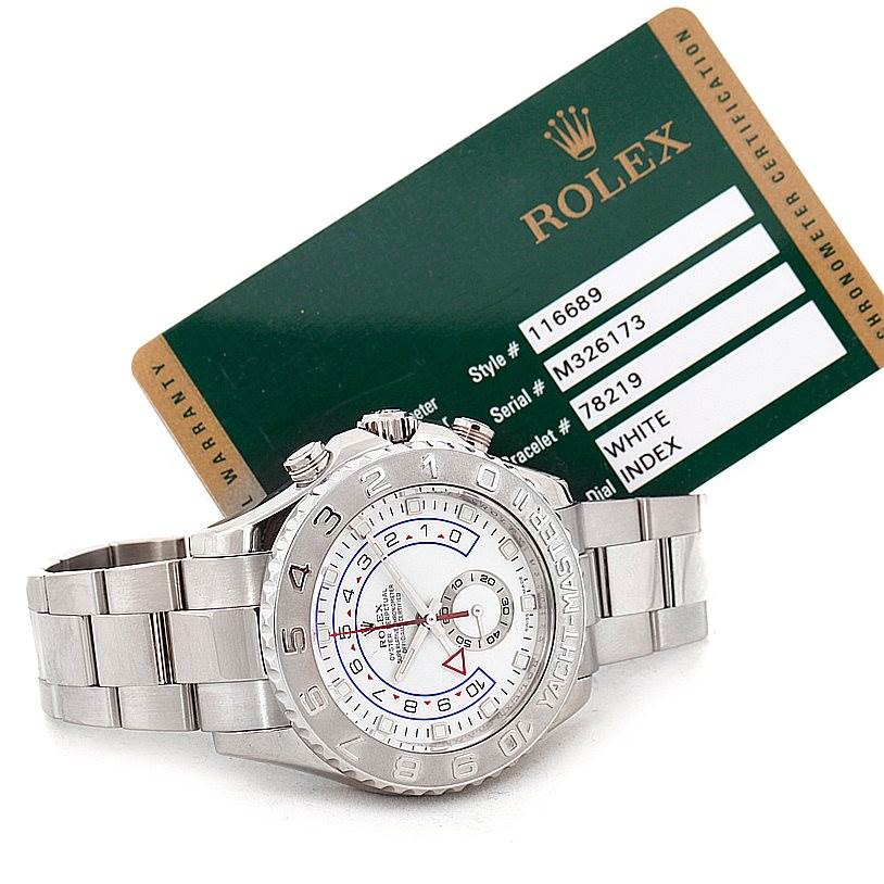 The Rolex Yacht-Master 116689 Men's White Gold White Dial 116689 Men's White Gold White Dial watch is shown at a diagonal angle, accompanied by its certification card displaying relevant model and serial numbers.