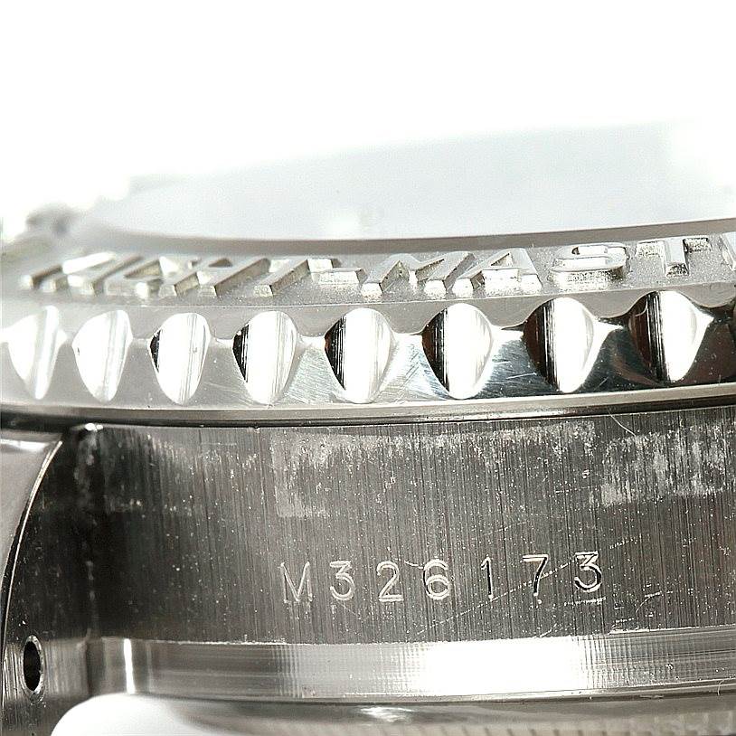 This close-up image shows the side of a Rolex Yacht-Master 116689 Men's White Gold White Dial 116689 Men's White Gold White Dial watch, highlighting the bezel and the serial number.