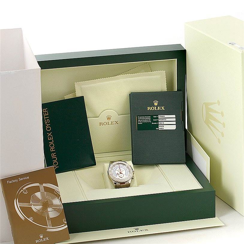The Rolex Yacht-Master 116689 Men's White Gold White Dial 116689 Men's White Gold White Dial watch and its accessories are displayed from a top angle inside its box, including manuals and service booklet.