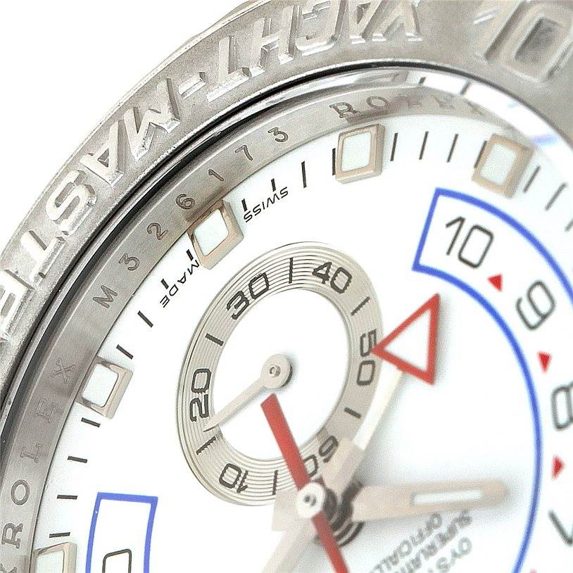 This close-up angle shows the bezel and part of the dial of the Rolex Yacht-Master 116689 Men's White Gold White Dial 116689 Men's White Gold White Dial watch, highlighting the hour markers and minute hand.