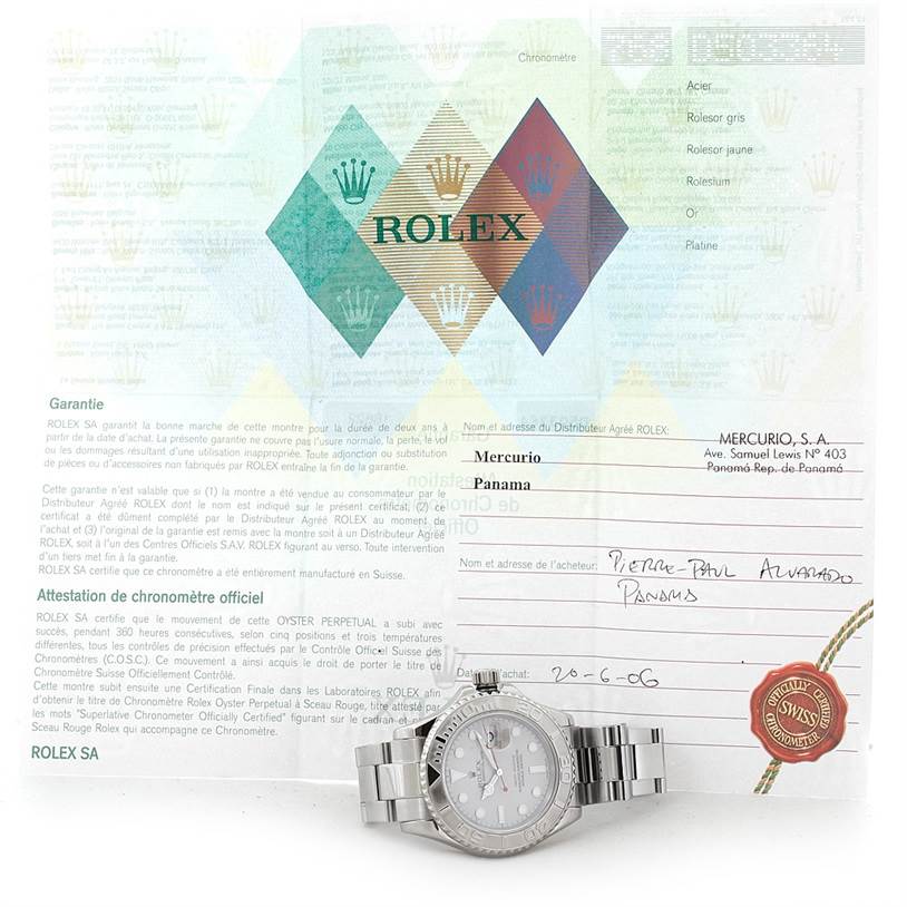 The image shows a Rolex Yacht-Master 16622 Men's Stainless Steel Silver Dial 16622 Men's Stainless Steel Silver Dial watch face and bracelet alongside its warranty paperwork and documentation.