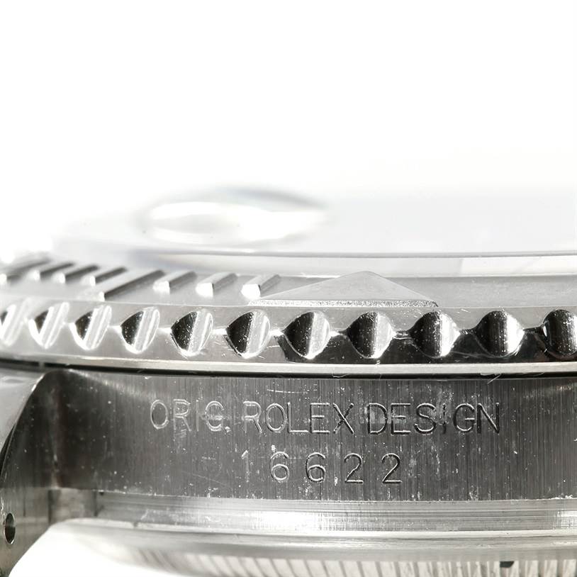 Close-up of the Rolex Yacht-Master 16622 Men's Stainless Steel Silver Dial 16622 Men's Stainless Steel Silver Dial case, showing its engraved serial number and part of the bezel.