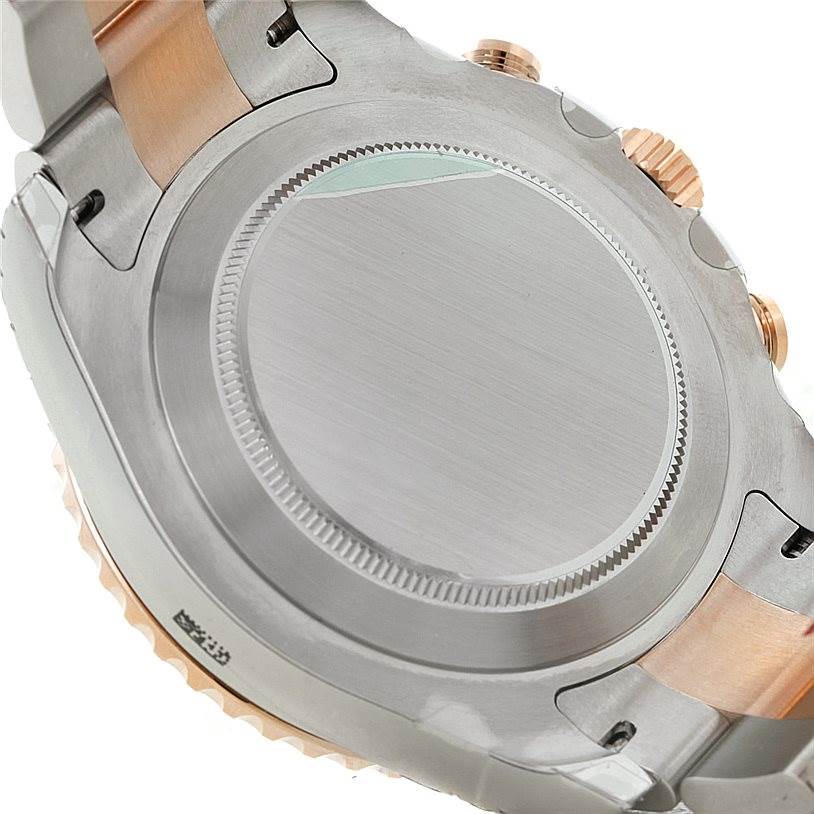 The image shows the case back of a Rolex Yacht-Master 116681 Men's Steel and Gold (two tone) White Dial 116681 Men's Steel and Gold (two tone) White Dial watch viewed from the rear angle, highlighting the metal finish and crown.