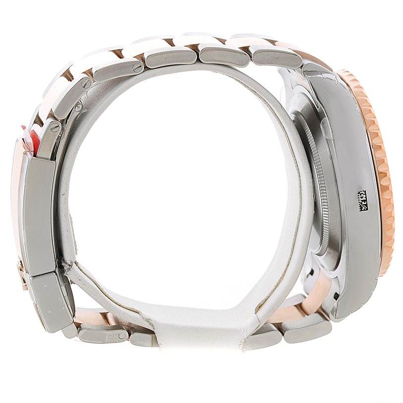 Side profile view of the Rolex Yacht-Master 116681 Men's Steel and Gold (two tone) White Dial 116681 Men's Steel and Gold (two tone) White Dial watch, showcasing the bracelet, clasp, case, and bezel.