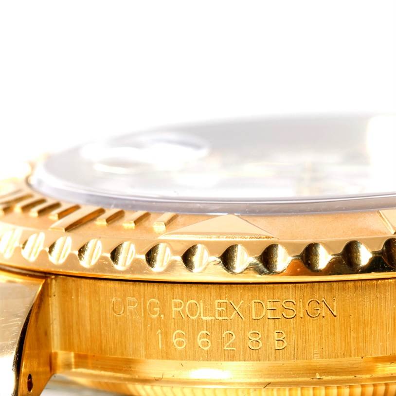 This close-up angle shows the side view of the bezel and the case of the Rolex Yacht-Master 16628 Men's Yellow Gold White Dial 16628 Men's Yellow Gold White Dial watch, highlighting its design and engraving.