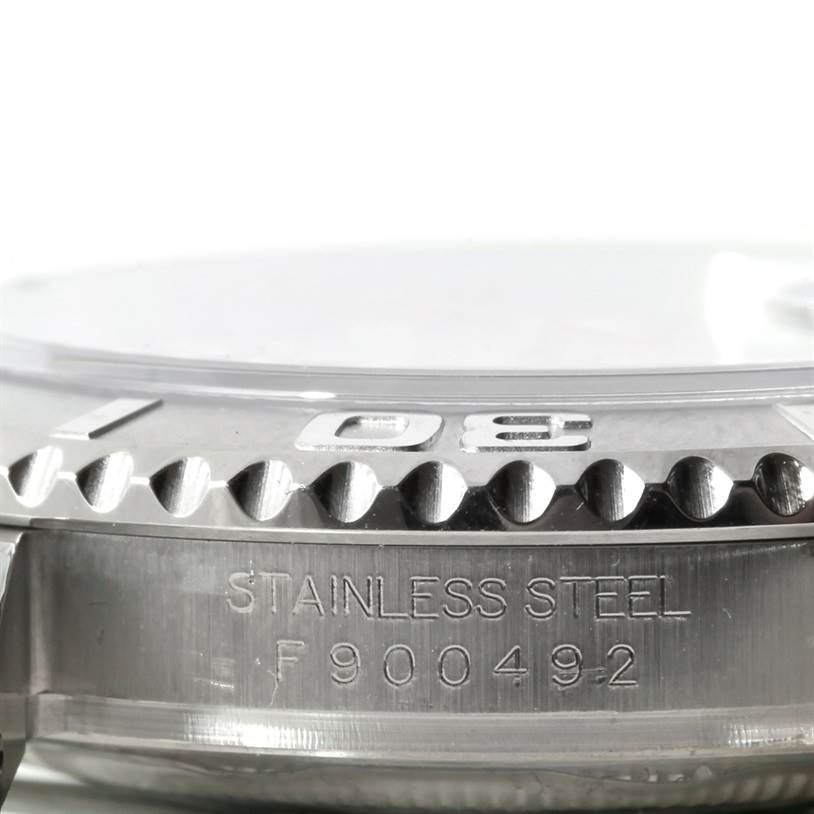 The image shows a close-up of the side view of a Rolex Yacht-Master 16622 Men's Stainless Steel Silver Dial 16622 Men's Stainless Steel Silver Dial watch, featuring the bezel and case with engraved details.