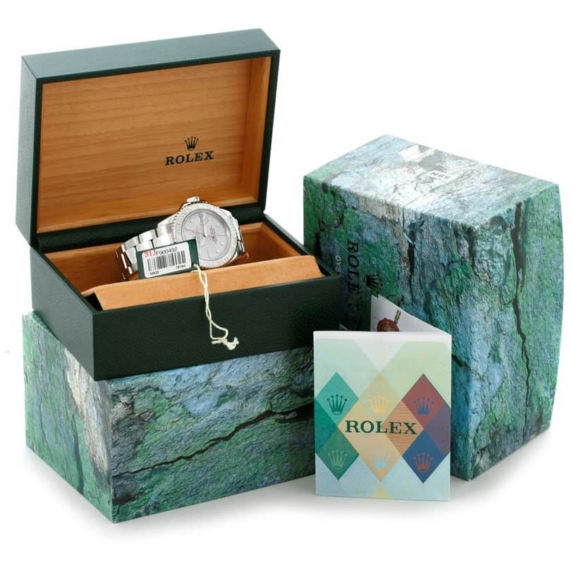 The Rolex Yacht-Master 16622 Men's Stainless Steel Silver Dial 16622 Men's Stainless Steel Silver Dial watch is shown at an angle inside its open box, along with its outer box and booklet.