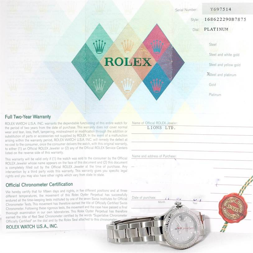 This image shows a Rolex Yacht-Master 168622 Stainless Steel Silver Dial 168622 Stainless Steel Silver Dial watch alongside its warranty certificate, both viewed from above.