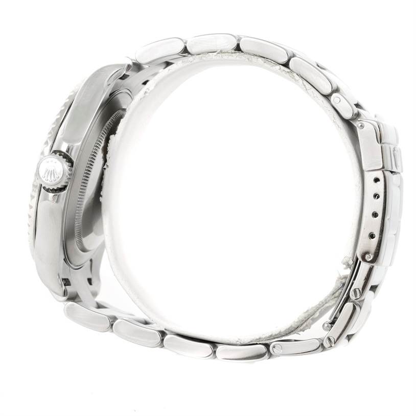 The image shows a side view of the Rolex Yacht-Master 16622 Men
s Stainless Steel Silver Dial 16622 Men
s Stainless Steel Silver Dial watch, focusing on its steel case, bezel, crown, and bracelet.