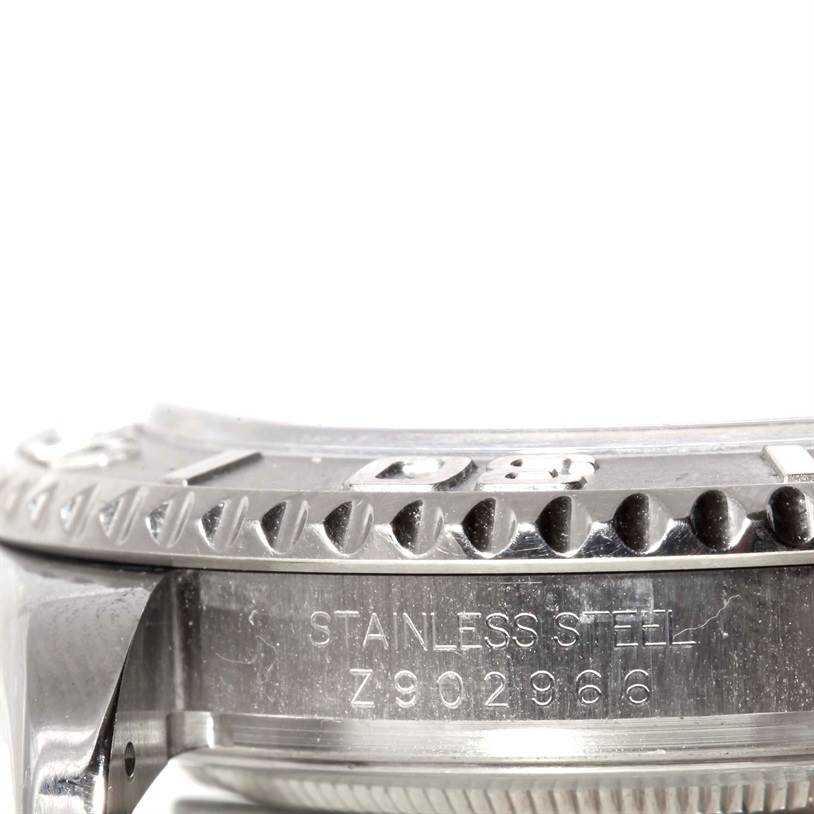 This image shows a close-up view of the case side and bezel of a Rolex Yacht-Master 16622 Men's Stainless Steel Silver Dial 16622 Men's Stainless Steel Silver Dial watch, highlighting the serial number and "Stainless Steel" inscription.