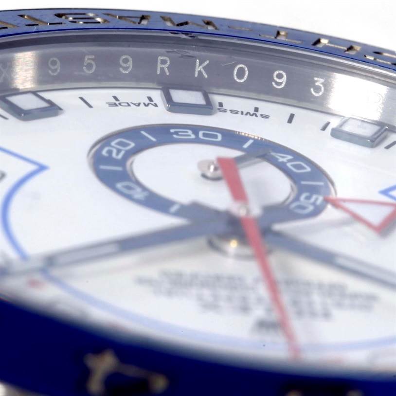 This close-up image of a Rolex Yacht-Master 116680 Men
s Stainless Steel White Dial 116680 Men
s Stainless Steel White Dial watch shows the dial focusing on the hands and part of the bezel.