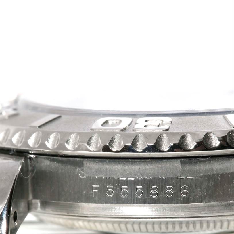 This image shows a close-up side angle of the bezel and part of the case of a Rolex Yacht-Master 16622 Men's Stainless Steel Silver Dial 16622 Men's Stainless Steel Silver Dial watch.