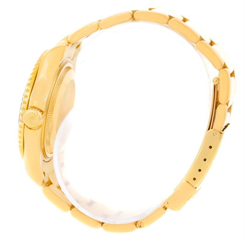 The image shows a side view of the Rolex Yacht-Master 68628 Men
s Yellow Gold Blue Dial 68628 Men
s Yellow Gold Blue Dial watch, highlighting its crown, case, and part of its bracelet.