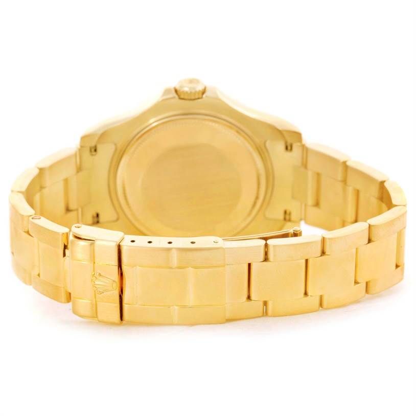 The image shows the back view of a Rolex Yacht-Master 68628 Men
s Yellow Gold Blue Dial 68628 Men
s Yellow Gold Blue Dial watch, highlighting its gold case, bracelet, and clasp.