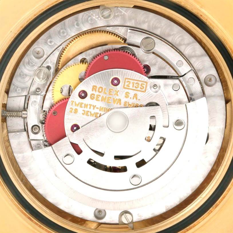 The image shows the movement and internal mechanics of a Rolex Yacht-Master 68628 Men
s Yellow Gold Blue Dial 68628 Men
s Yellow Gold Blue Dial watch from a rear view.