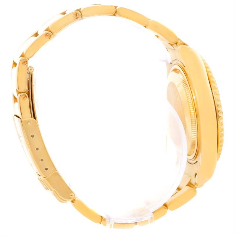 The image shows a side profile of a Rolex Yacht-Master 68628 Men
s Yellow Gold Blue Dial 68628 Men
s Yellow Gold Blue Dial watch showcasing its gold bracelet and case.