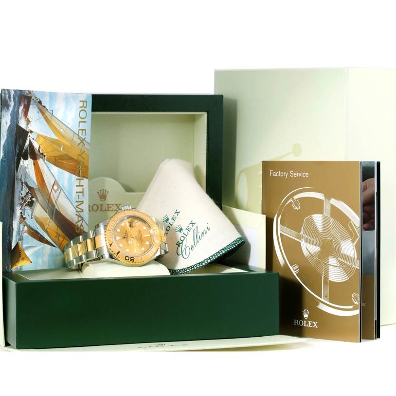 The image shows a Rolex Yacht-Master 16623 Men's Stainless Steel Champagne Dial 16623 Men's Stainless Steel Champagne Dial watch in its box along with the instruction booklet, warranty card, and cleaning cloth.