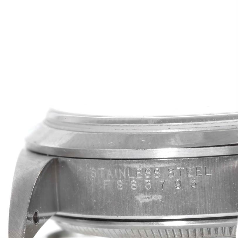 This close-up image shows the side of the case and lug details of a Rolex Air-King 14000 Men's Stainless Steel Black Dial 14000 Men's Stainless Steel Black Dial watch, highlighting the "STAINLESS STEEL" and serial number engravings.