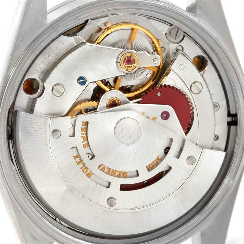 This image shows a detailed view of the movement mechanism of a Rolex Air-King 14000 Men's Stainless Steel Blue Dial 14000 Men's Stainless Steel Blue Dial watch, capturing its inner components.