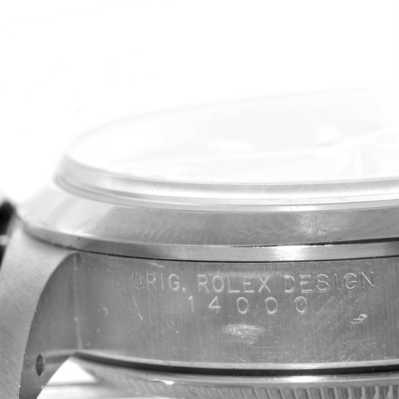 The image shows a close-up side angle of the case of a Rolex Air-King 14000 Men's Stainless Steel Blue Dial 14000 Men's Stainless Steel Blue Dial watch, displaying its engraving.