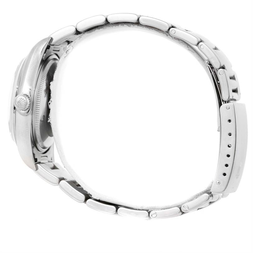 The image shows a side angle of a Rolex Air-King 14000 Men's Stainless Steel Pink Dial 14000 Men's Stainless Steel Pink Dial watch, focusing on its case, crown, and bracelet.