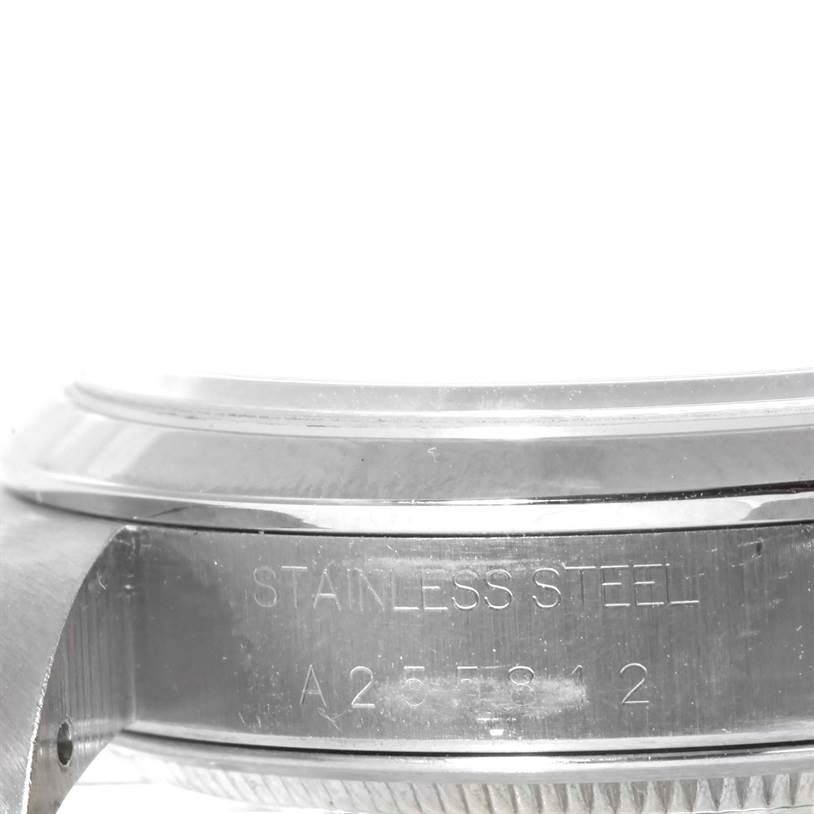 The image shows a close-up of the side and case back of a Rolex Air-King 14000 Men's Stainless Steel Pink Dial 14000 Men's Stainless Steel Pink Dial watch, highlighting the stainless steel material and serial number.