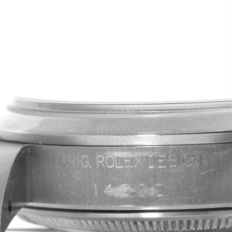 This image shows a close-up side view of the case's engraved detail from an Air-King model by Rolex.