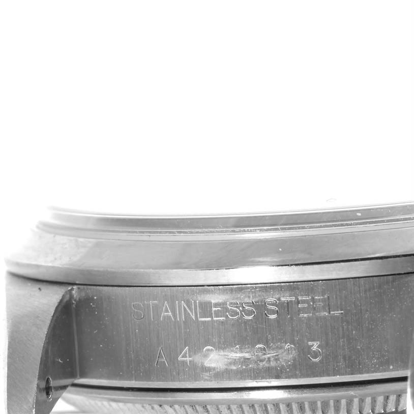 This image shows a close-up angle of the case side of the Rolex Air-King 14000 Men's Stainless Steel Blue Dial 14000 Men's Stainless Steel Blue Dial watch, highlighting the stainless steel engraving and part of the serial number.