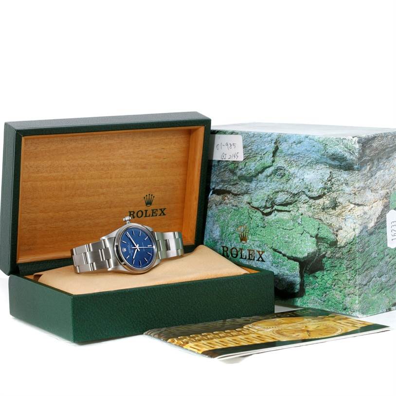 The Rolex Air-King 14000 Men's Stainless Steel Blue Dial 14000 Men's Stainless Steel Blue Dial watch is displayed in its open box, showing the face, bracelet, and box cover.