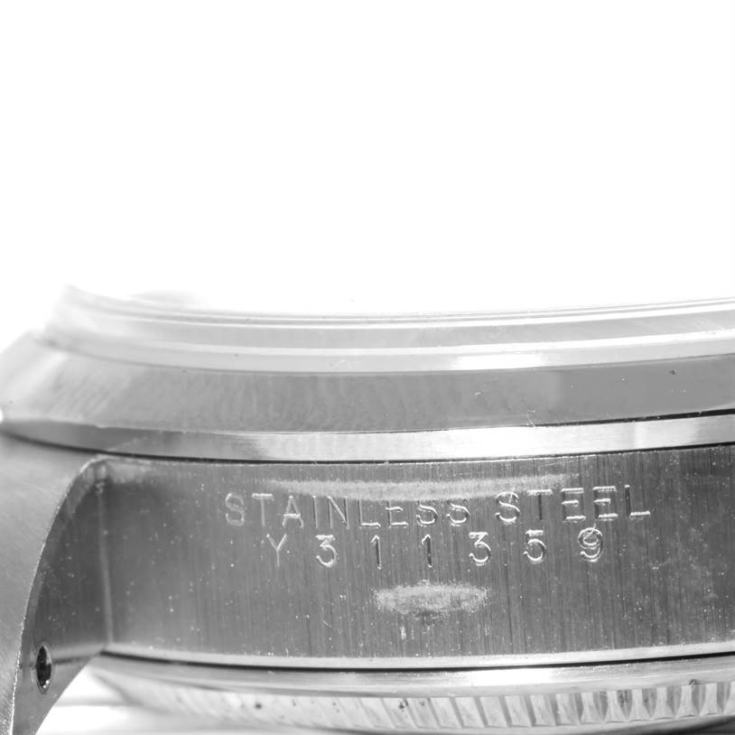 The image shows a close-up view of the stainless steel casing of a Rolex Air-King 14000 Men's Stainless Steel Black Dial 14000 Men's Stainless Steel Black Dial watch, highlighting the serial number.