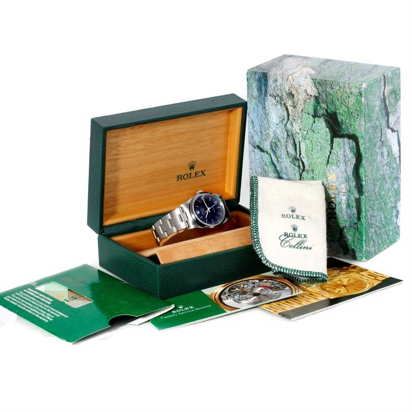 The image shows a Rolex Air-King 14000 Men's Stainless Steel Black Dial 14000 Men's Stainless Steel Black Dial watch in its box, with brochures, a cleaning cloth, and the outer packaging included.