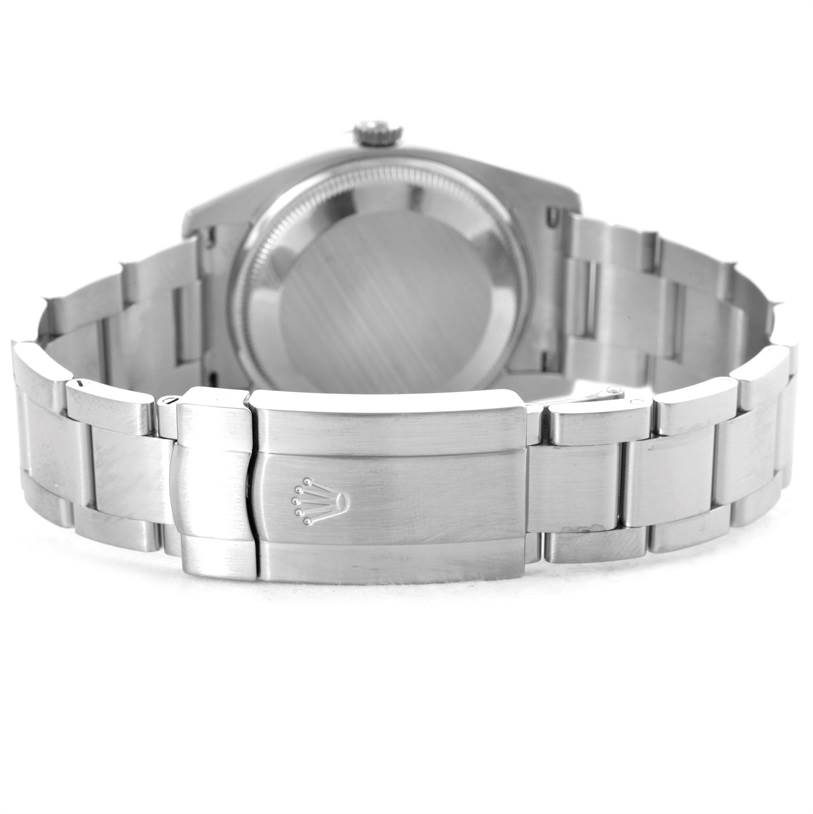 The image shows the back view of a Rolex Air-King 114200 Men's Stainless Steel Blue Dial 114200 Men's Stainless Steel Blue Dial watch, highlighting its case back, bracelet, and clasp.