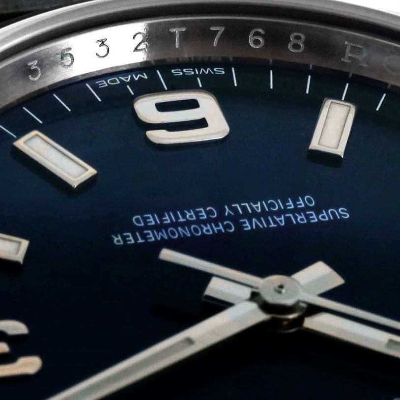 Close-up of the Rolex Air-King 114200 Men's Stainless Steel Blue Dial 114200 Men's Stainless Steel Blue Dial model showing part of the dial, hands, and numerals at an angled view.