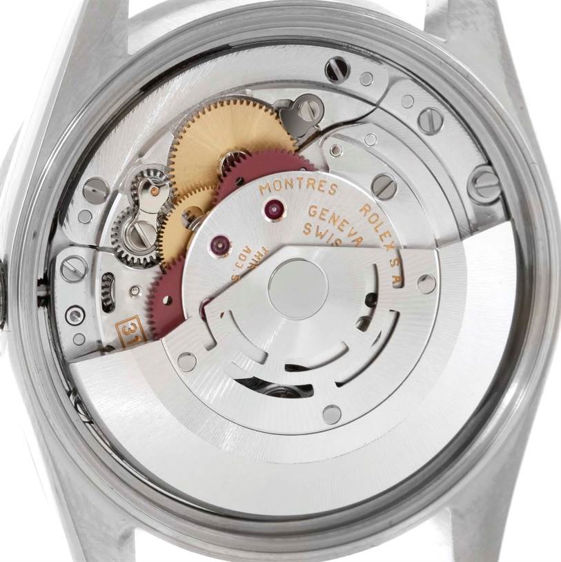 This image shows the internal mechanism of a Rolex Air-King 14010 Men's Stainless Steel Blue Dial 14010 Men's Stainless Steel Blue Dial watch from the back, revealing gears and the rotor.