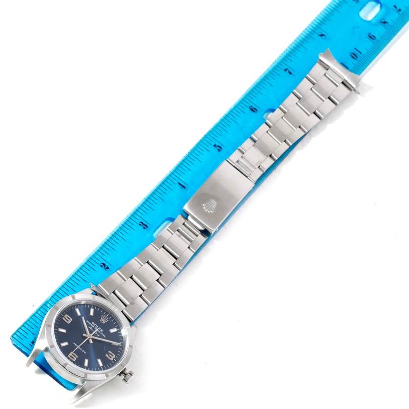 The image shows a Rolex Air-King 14010 Men's Stainless Steel Blue Dial 14010 Men's Stainless Steel Blue Dial watch laid flat with its bracelet extended and measured against a blue ruler.
