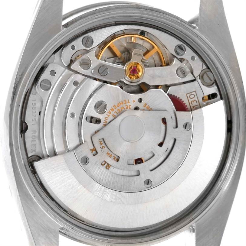 The image shows the internal mechanism of the Rolex Air-King 114210 Men's Stainless Steel Silver Dial 114210 Men's Stainless Steel Silver Dial watch from a close-up, top-down angle.