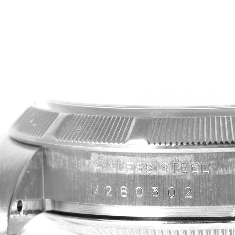 The image shows a close-up side view of the bezel and case of a Rolex Air-King 114210 Men's Stainless Steel Silver Dial 114210 Men's Stainless Steel Silver Dial watch, highlighting the stainless steel and model number.