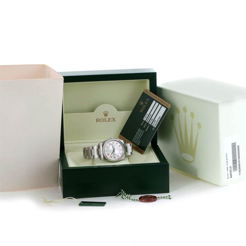 The image shows a Rolex Air-King 114210 Men's Stainless Steel Silver Dial 114210 Men's Stainless Steel Silver Dial watch in its original box, accompanied by a warranty card, tag, and additional packaging.