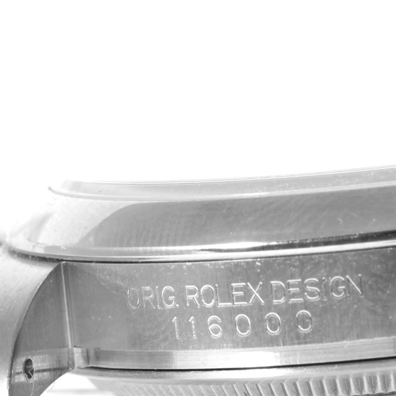 The image shows a side angle of the Rolex Air-King 114200 Men's Stainless Steel Silver Dial 114200 Men's Stainless Steel Silver Dial watch case with "ORIG. ROLEX DESIGN 116000" engraved.